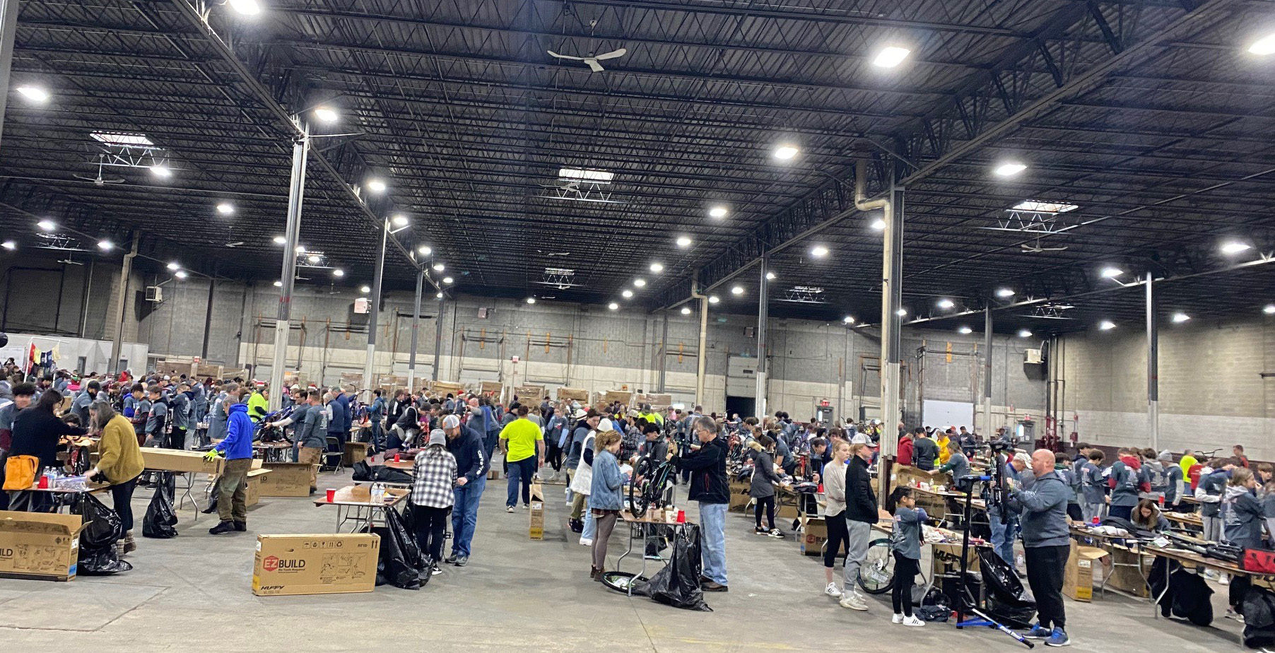 Elves & More volunteers assembling bikes at ASW Global