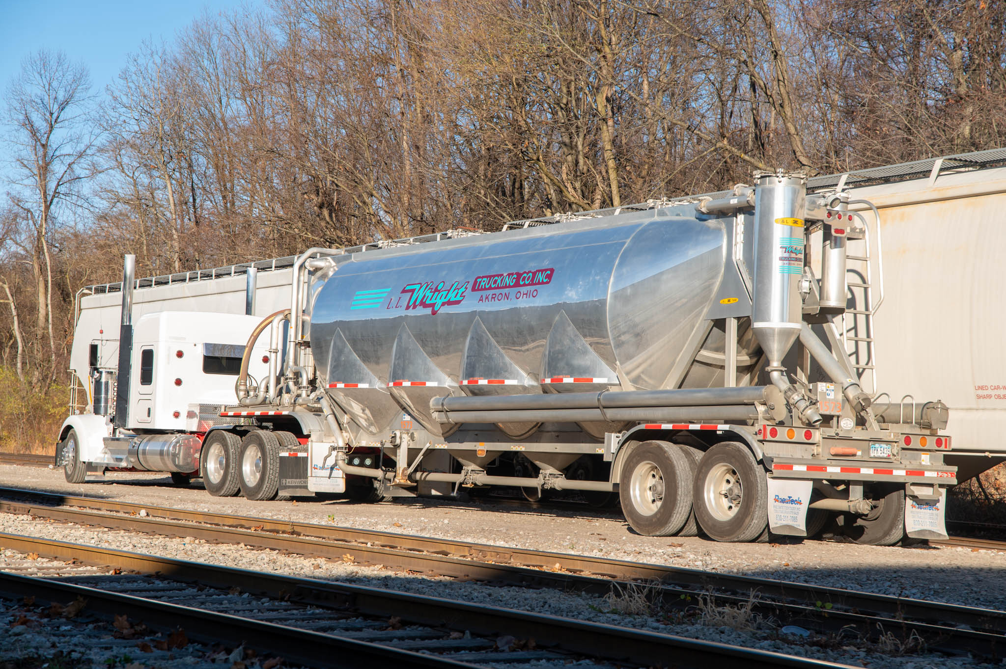 A tanker positions itself to receive polymer (resin) from a hopper car at ASW Global.