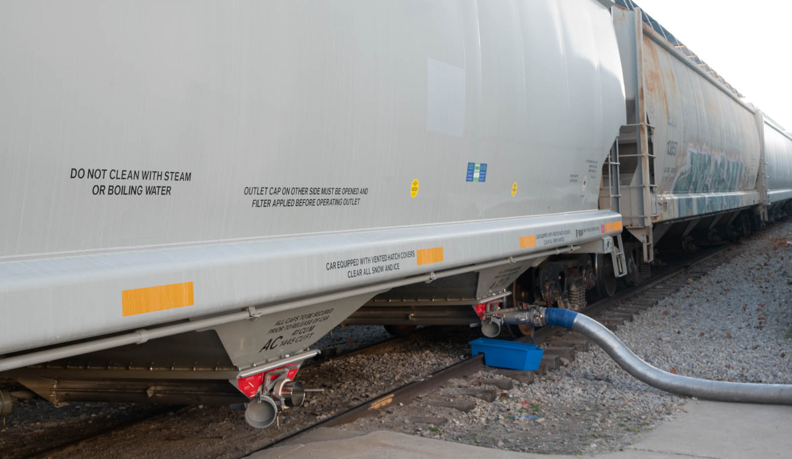 Polymer is being transloaded from this hopper car at ASW Global.