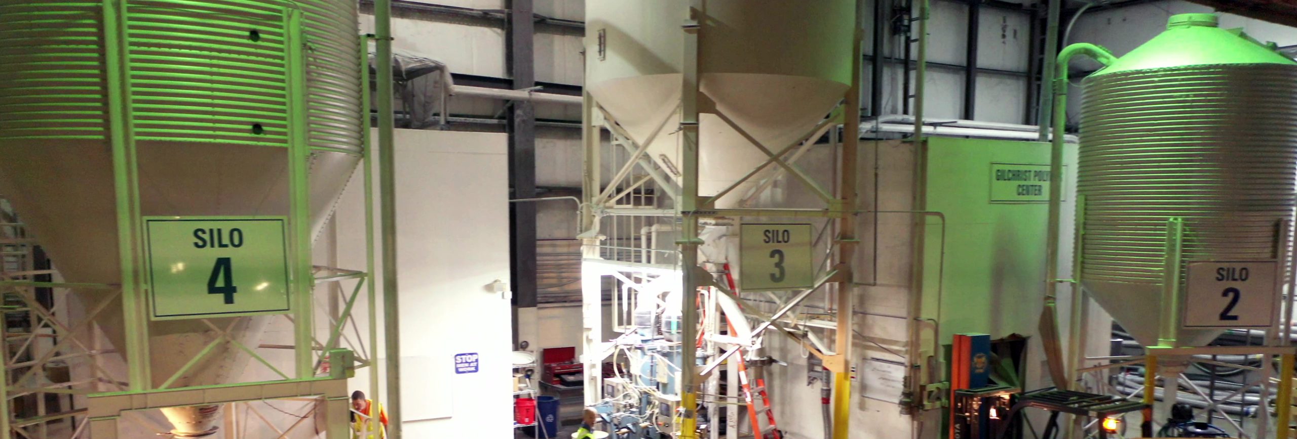 Three of ASW Global's silos are shown. The silos are part of ASW's polymer (resin) packaging stations.