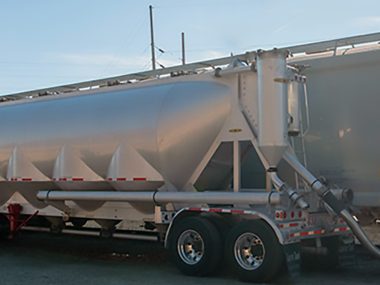 Plastic resin is transloaded from rail car to bulk truck as part of ASW