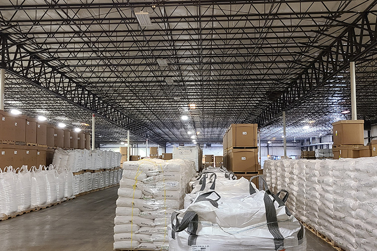 Aisles of packaged polymer (resin) in super sacks and 50 lb bags