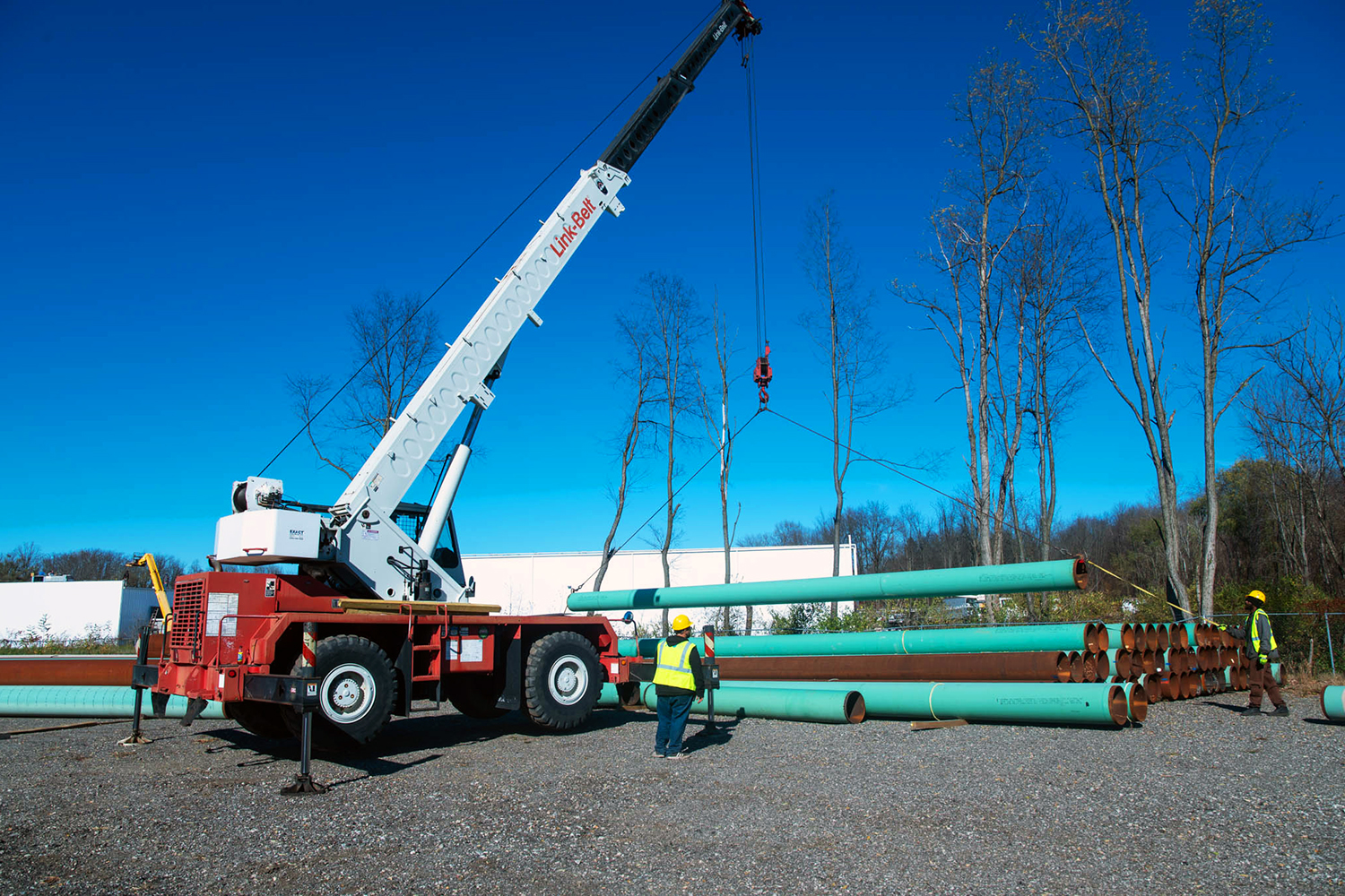 A crane positions pipe in ASW Energy Service's pipe yard in Akron, Ohio.