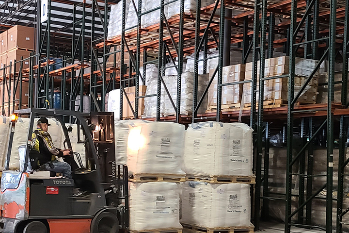 Forklift lifting bulk bags in ASW Akron warehouse