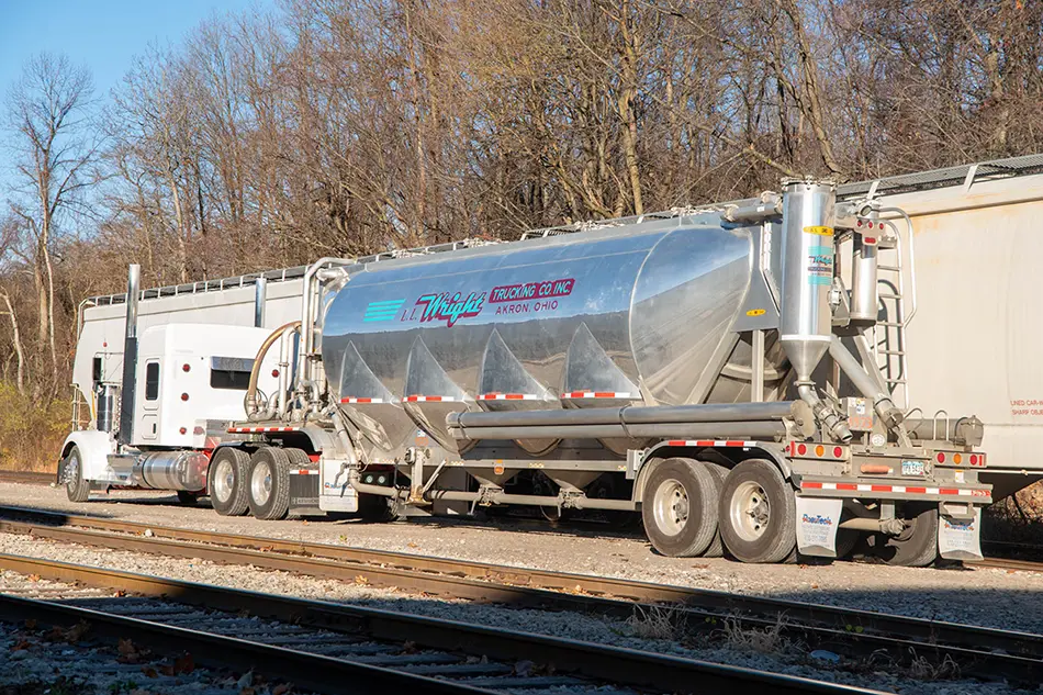 A tanker positions itself to receive polymer (resin) from a hopper car at ASW Global.