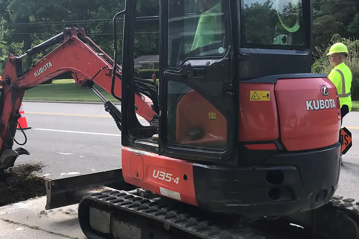 ASW uses a mini excavator to perform pipeline services