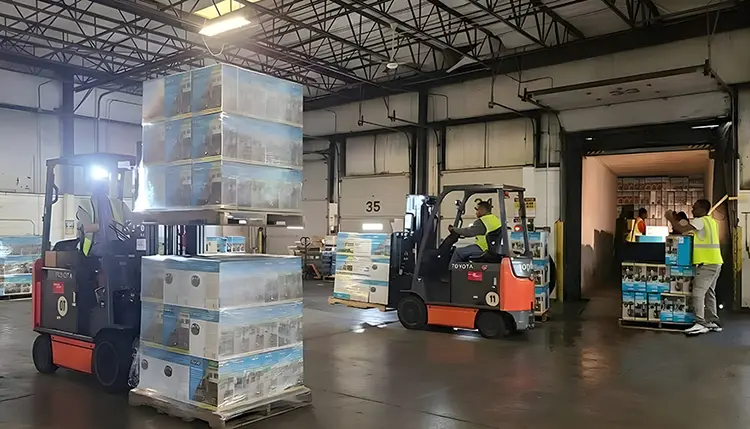 Floor-loaded container unloading and cross-docking